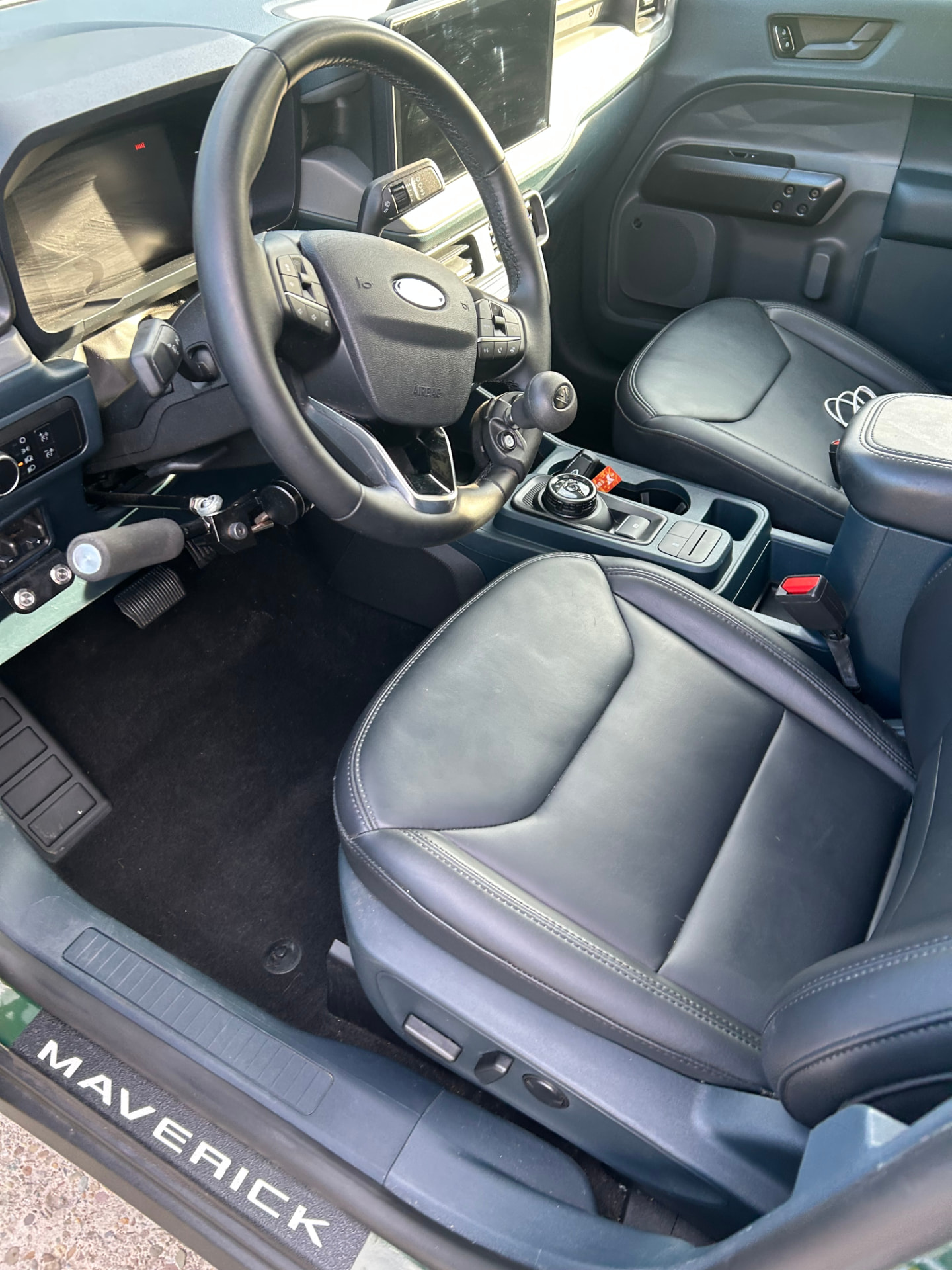 Ford Maverick interior with driver seat and steering wheel