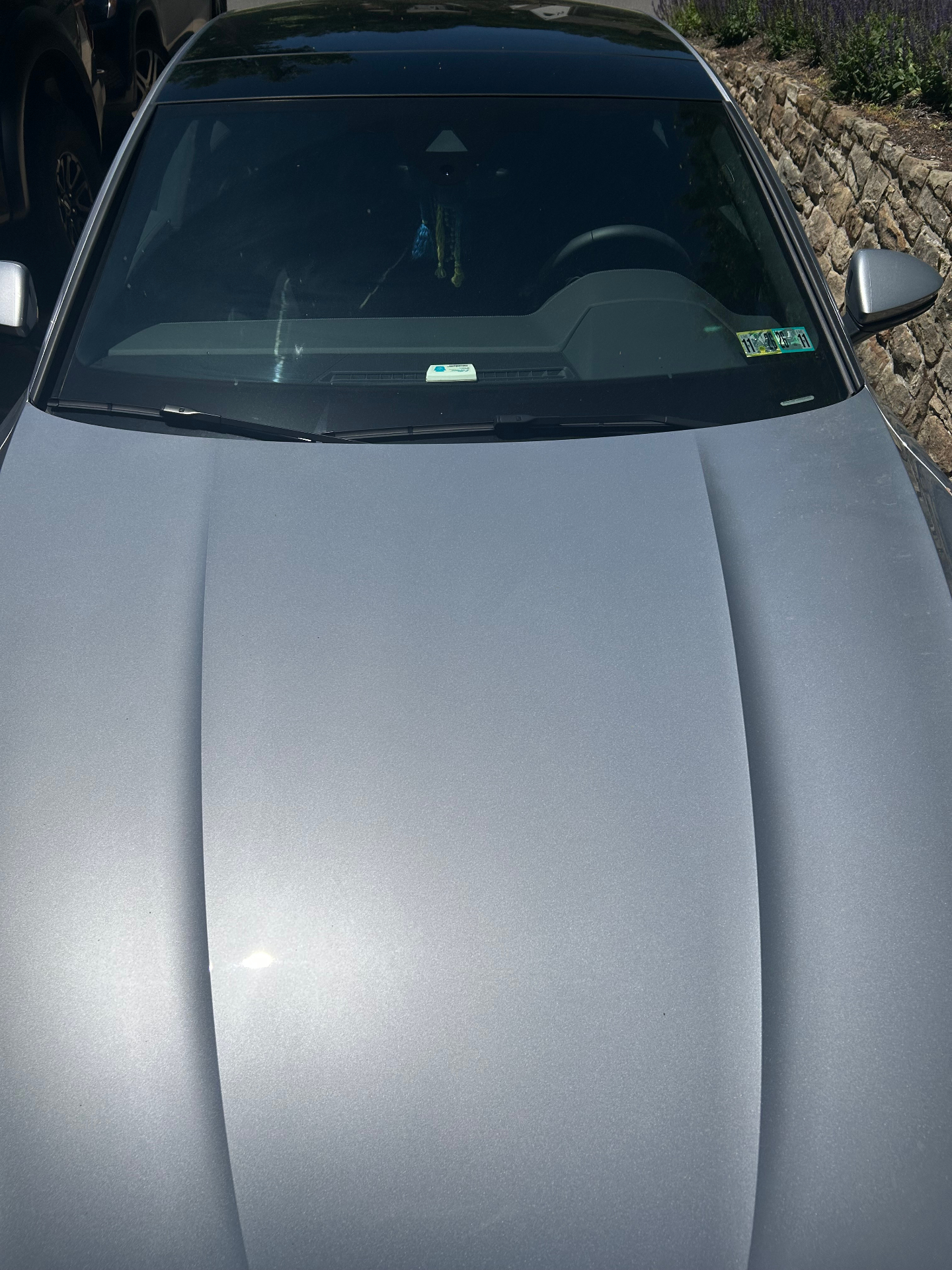 Silver Audi hood with mirror-like finish