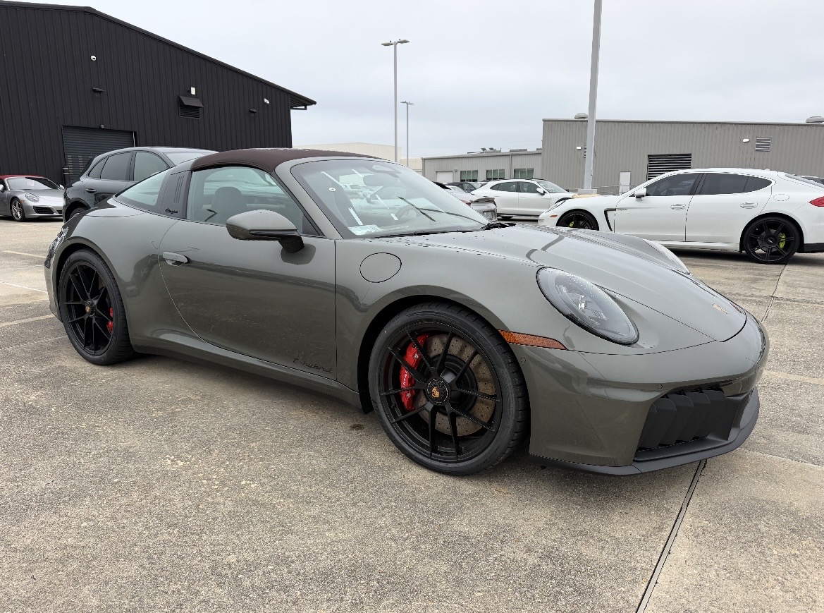 Freshly detailed gray Porsche parked outdoors